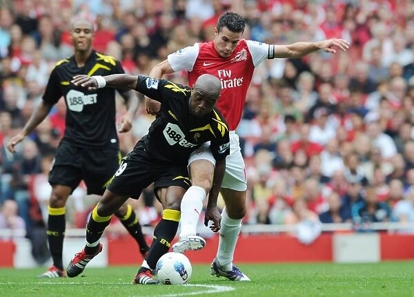 Arsenal's Robin van Persie Clashes with Nigel Reo-Coker of Bolton during the 2011-12 Premier League Match