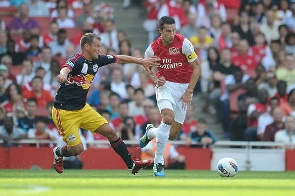 Arsenal's Robin van Persie Faces Off Against Teemu Tainio of New York Red Bulls during the 2011-12 Emirates Cup