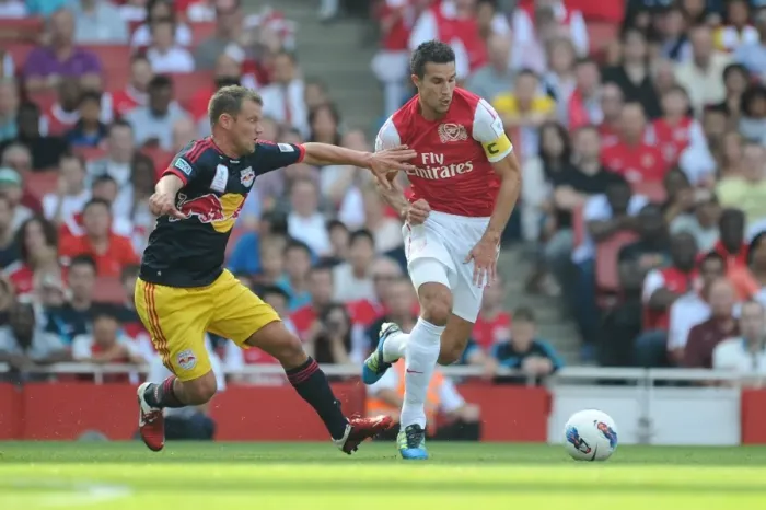 Framed Print : Arsenal's Robin van Persie Faces Off Against Teemu Tainio of New York Red Bulls during the 2011-12 Emirates Cup