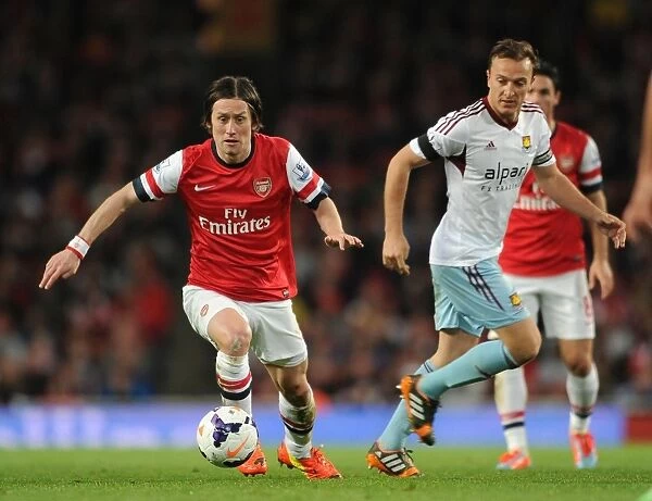 Arsenal's Rosicky Clashes with West Ham's Noble in Premier League Showdown