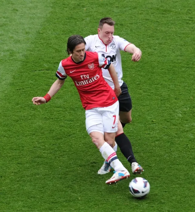Framed Print : Arsenal's Rosicky Evades Manchester United's Jones: A Premier League Battle