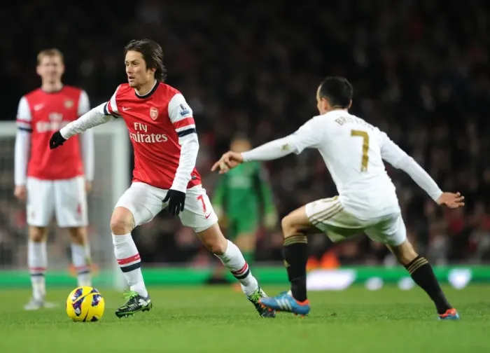 Framed Print : Arsenal's Rosicky Fends Off Swansea's Britton in Premier League Clash Framed Print : Arsenal's Rosicky Fends Off Swansea's Britton in Premier League Clash