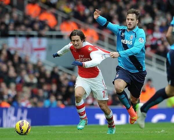 Arsenal's Rosicky Fouled by Arnautovic in Intense Arsenal v Stoke City Clash (2014-15)