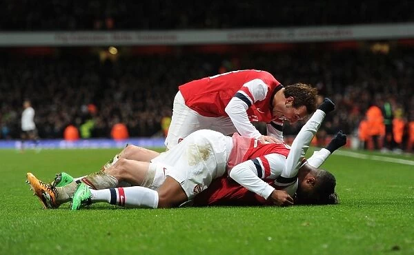 Arsenal's Rosicky, Girabsy, and Cazorla Celebrate Goals Against Tottenham in FA Cup Third Round