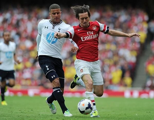 Arsenal's Rosicky Outmaneuvers Tottenham's Walker in Premier League Showdown