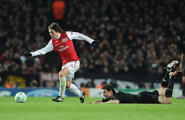 Arsenal's Rosicky Outmaneuvers Van Bommel in 2012 Champions League Clash