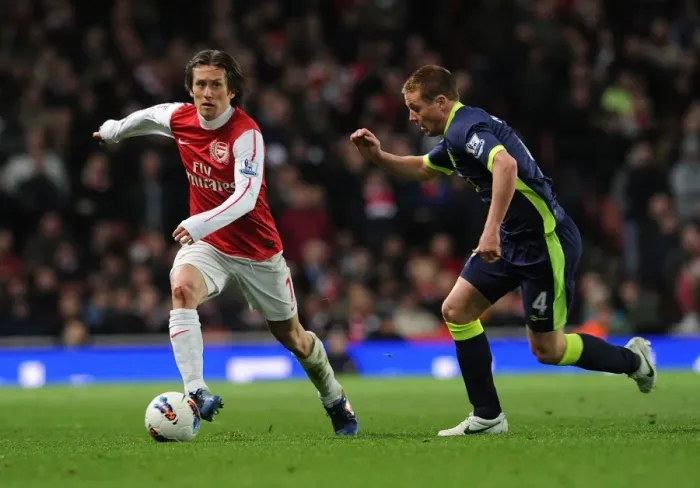 Framed Print : Arsenal's Rosicky Outmaneuvers Wigan's McCarthy in 2011-12 Premier League Clash Framed Print : Arsenal's Rosicky Outmaneuvers Wigan's McCarthy in 2011-12 Premier League Clash