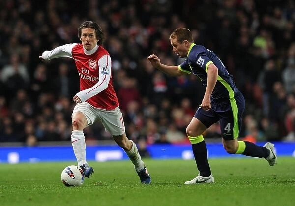 Arsenal's Rosicky Outmaneuvers Wigan's McCarthy in 2011-12 Premier League Clash
