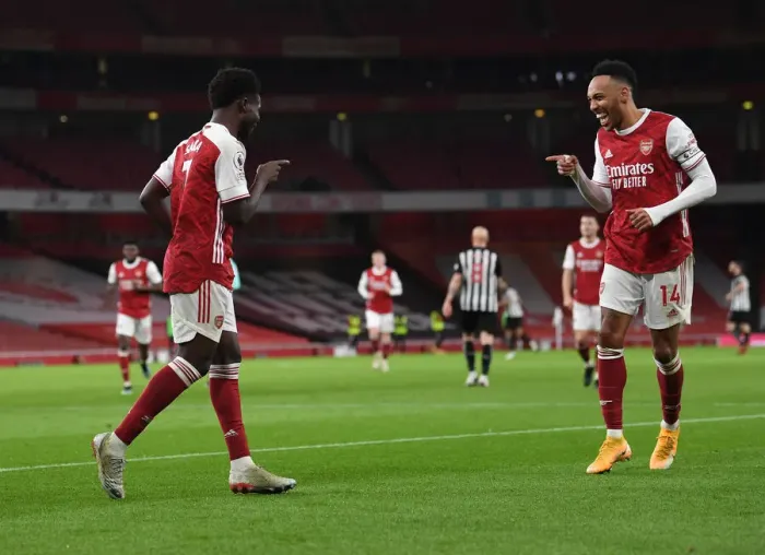 Framed Print : Arsenal's Saka and Aubameyang Celebrate Goals in Empty Emirates Stadium Against Newcastle United (2021) Framed Print : Arsenal's Saka and Aubameyang Celebrate Goals in Empty Emirates Stadium Against Newcastle United (2021)