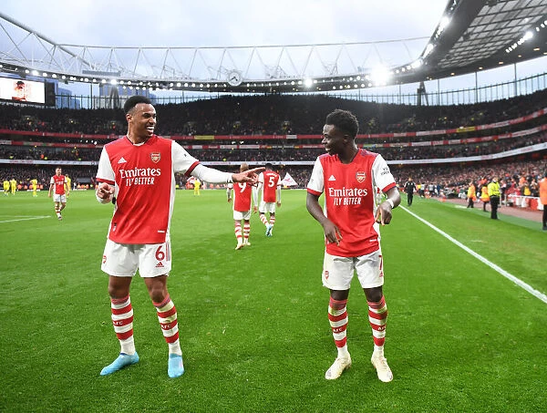 Arsenal's Saka and Gabriel Celebrate Second Goal Against Brentford, Premier League 2021-22