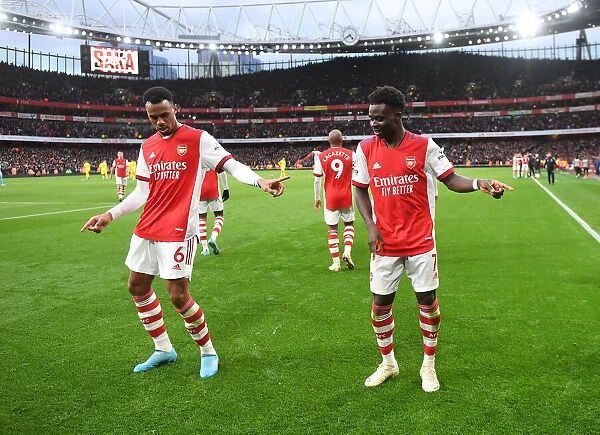 Arsenal's Saka and Gabriel: A Celebratory Moment during the Arsenal vs. Brentford Match (2021-22)