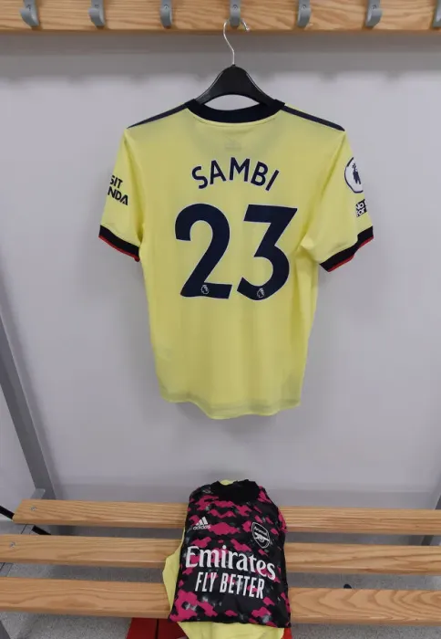Framed Print : Arsenal's Saka: Pre-Match Routine in the Changing Room Before Brighton Clash