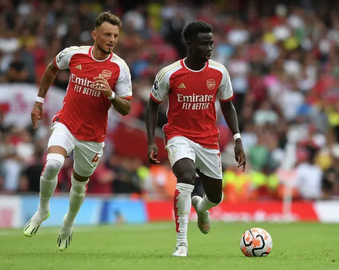 Framed Print : Arsenal's Saka and White in Action: Arsenal FC vs. Nottingham Forest, 2023-24 Premier League