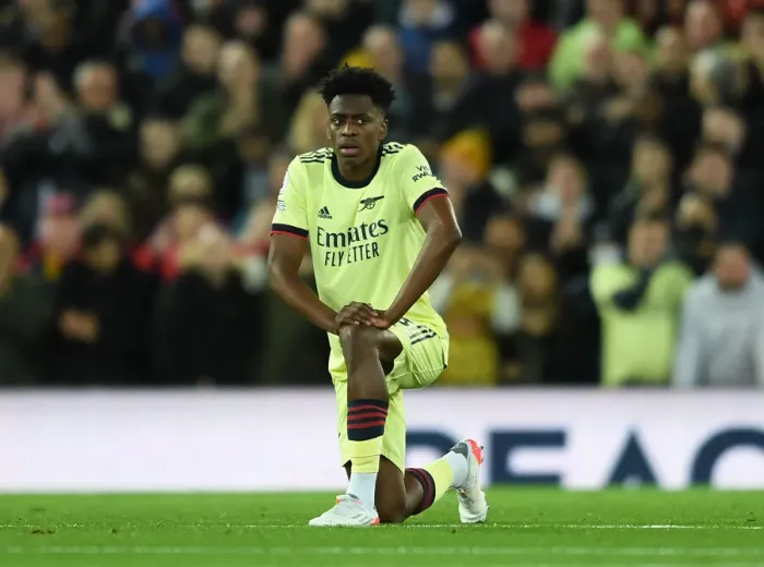 Framed Print : Arsenal's Sambi Lokonga Kneels During Liverpool vs Arsenal Premier League Match (2021-22) Framed Print : Arsenal's Sambi Lokonga Kneels During Liverpool vs Arsenal Premier League Match (2021-22)