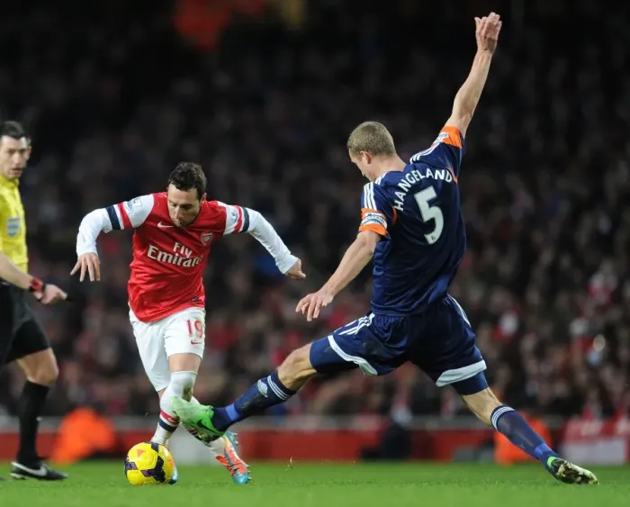 Framed Print : Arsenal's Santi Cazorla Clashes with Fulham's Brede Hangeland during the Premier League Match Framed Print : Arsenal's Santi Cazorla Clashes with Fulham's Brede Hangeland during the Premier League Match