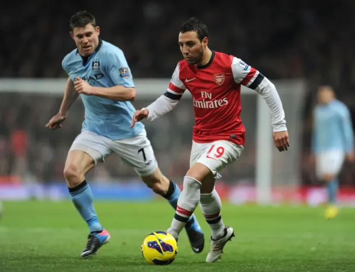 Framed Print : Arsenal's Santi Cazorla Clashes with Manchester City's James Milner in Premier League Showdown Framed Print : Arsenal's Santi Cazorla Clashes with Manchester City's James Milner in Premier League Showdown