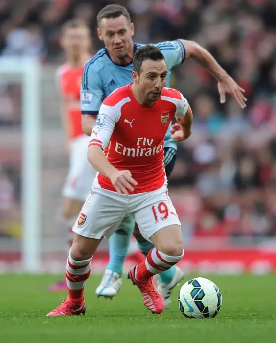 Framed Print : Arsenal's Santi Cazorla Dashes Past West Ham's Kevin Nolan in Premier League Clash