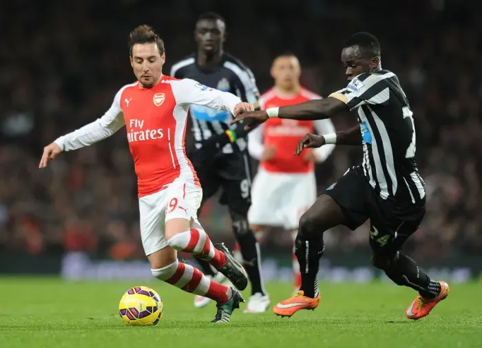 Framed Print : Arsenal's Santi Cazorla Dodges Newcastle's Cheick Tiote at the Emirates Stadium, 2014 / 15 Premier League Framed Print : Arsenal's Santi Cazorla Dodges Newcastle's Cheick Tiote at the Emirates Stadium, 2014 / 15 Premier League