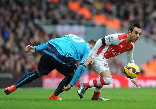 Arsenal's Santi Cazorla Evades Marko Arnautovic's Challenge in Thrilling Arsenal vs Stoke Showdown