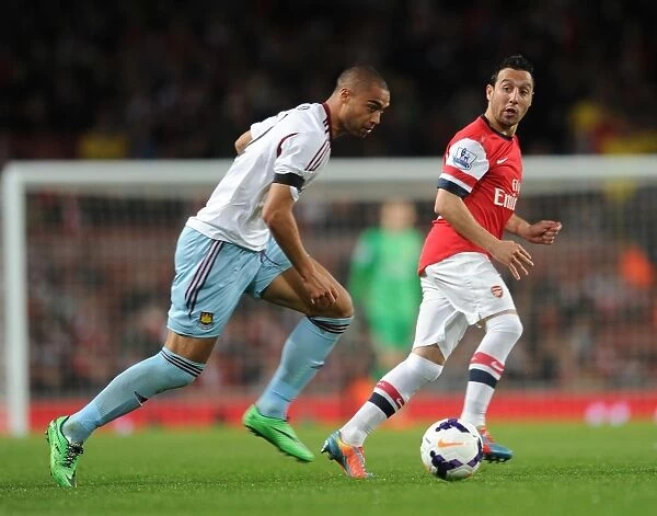 Arsenal's Santi Cazorla Evades Winston Reid's Pressure during Arsenal v West Ham United (2013 / 14)