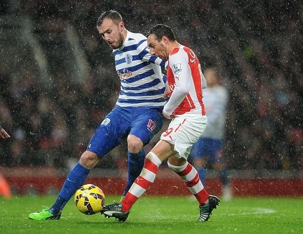 Arsenal's Santi Cazorla Faces Off Against QPR's Jordan Mutch in Premier League Clash