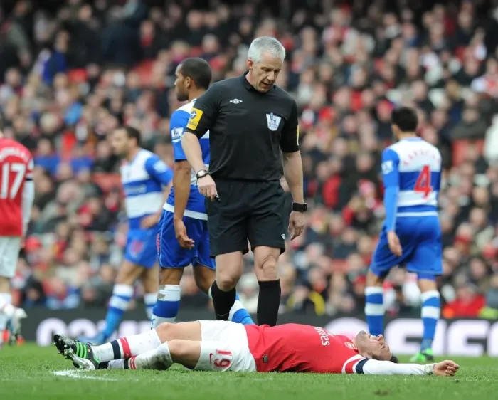 Framed Print : Arsenal's Santi Cazorla Injured During Arsenal v Reading Premier League Match Framed Print : Arsenal's Santi Cazorla Injured During Arsenal v Reading Premier League Match
