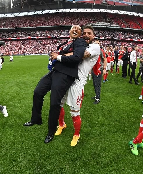 Arsenal's Santi Cazorla and Olivier Giroud Celebrate FA Cup Victory over Chelsea