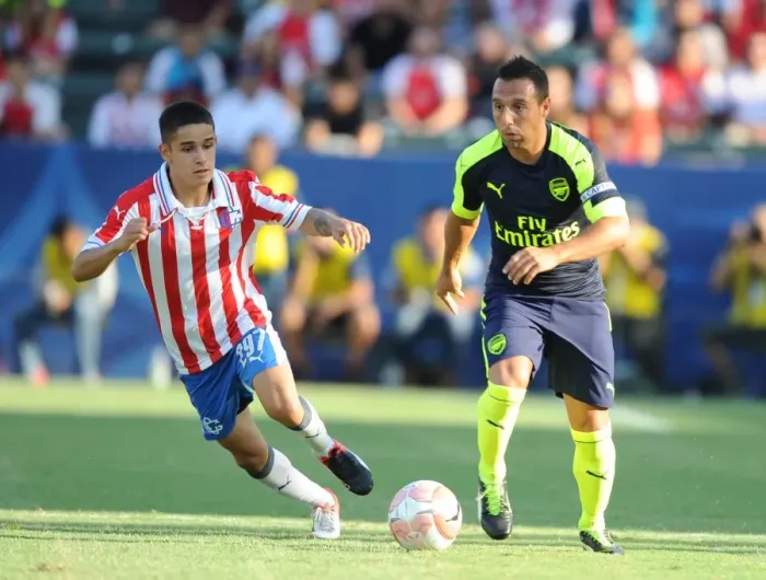 Framed Print : Arsenal's Santi Cazorla Outsmarts Chivas Edson Torres: A Pre-Season Masterclass