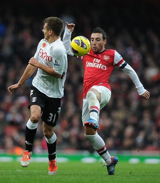Arsenal's Santi Cazorla Wins the Ball from Fulham's Alex Kacanikic (2012-13)