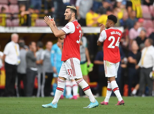 Arsenal's Sead Kolasinac Celebrates with Fans: Victory over Watford