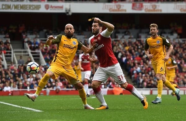 Arsenal's Sead Kolasinac Clashes with Brighton's Bruno Saltor in Premier League Showdown