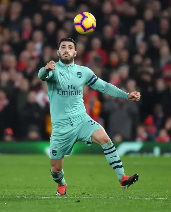 Framed Print : Arsenal's Sead Kolasinac Goes Head-to-Head with Liverpool in Intense Premier League Showdown
