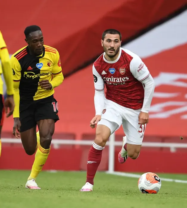 Framed Print : Arsenal's Sead Kolasinac Surges Past Danny Welbeck in Arsenal v Watford Clash (2019-20)