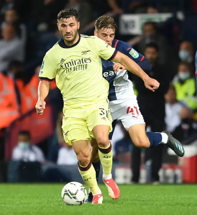 Framed Print : Arsenal's Sead Kolasinac and West Bromwich Albion's Tom Fellows Clash in Intense Carabao Cup Encounter