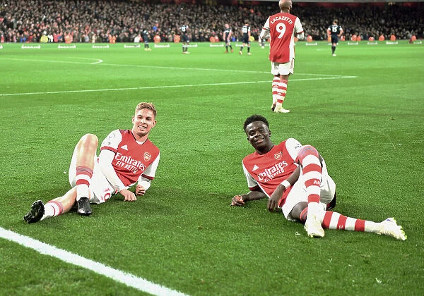Arsenal's Smith Rowe and Saka Celebrate Goals Against West Ham in Premier League Clash