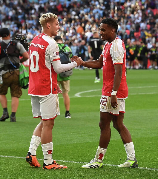 Arsenal's Smith Rowe and Timber: Celebrating Community Shield Victory with a Triumphant Embrace