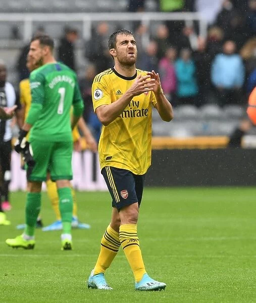 Arsenal's Sokratis Celebrates with Fans After Newcastle Victory