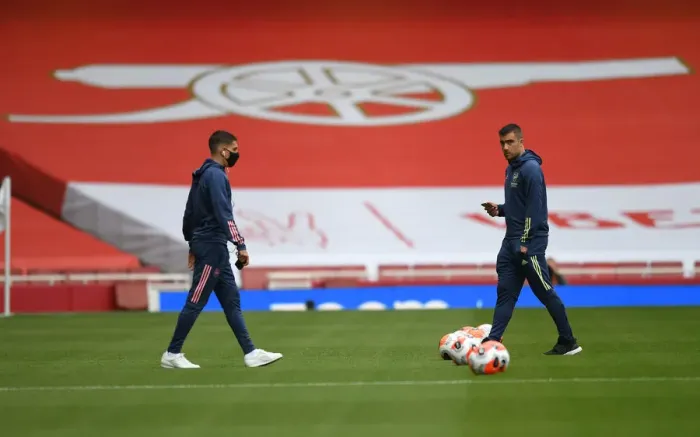 Framed Print : Arsenal's Sokratis Prepares for Empty Arsenal FC vs Liverpool FC Clash (2019-20)