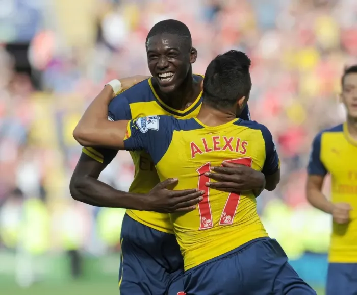 Framed Print : Arsenal's Star Duo: Sanchez and Sanogo in Glory: Celebrating a Goal Against Leicester City (2014-15) Framed Print : Arsenal's Star Duo: Sanchez and Sanogo in Glory: Celebrating a Goal Against Leicester City (2014-15)