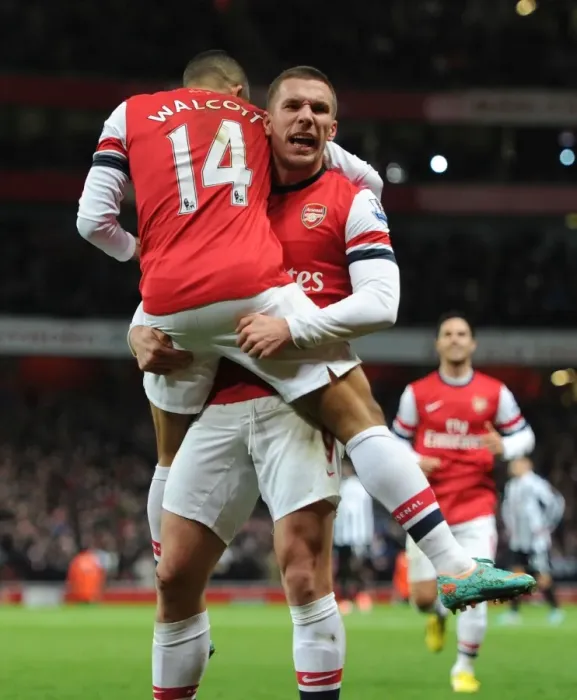 Framed Print : Arsenal's Star Duo: Walcott and Podolski Celebrate First Goal Against Newcastle United (2012-13) Framed Print : Arsenal's Star Duo: Walcott and Podolski Celebrate First Goal Against Newcastle United (2012-13)