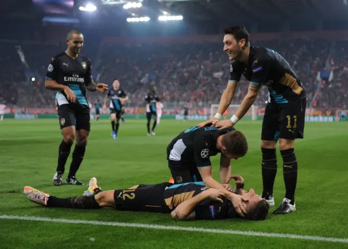 Framed Print : Arsenal's Star Players: Giroud, Ramsey, Ozil, and Walcott Celebrate Goals Against Olympiacos in the UEFA Champions League