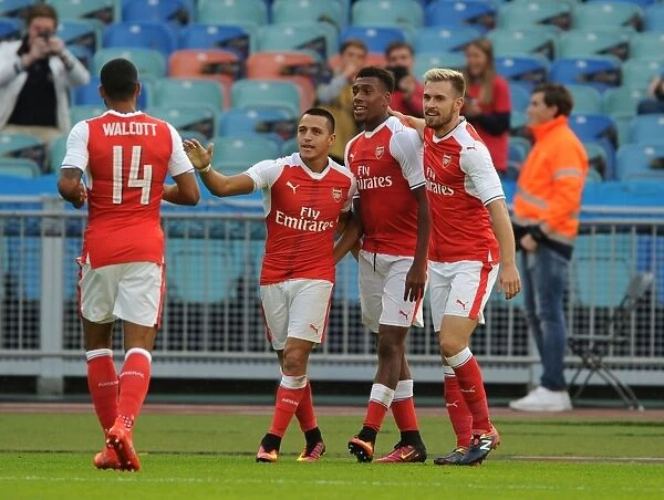 Arsenal's Star Quartet: Iwobi, Ramsey, Sanchez, and Walcott Celebrate First Goal Against Manchester City in 2016-17 Pre-Season