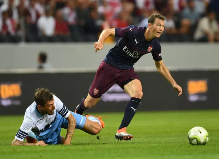 Framed Print : Arsenal's Stephan Lichtsteiner Clashes with Lazio's Francesco Acerbi in Pre-Season Friendly