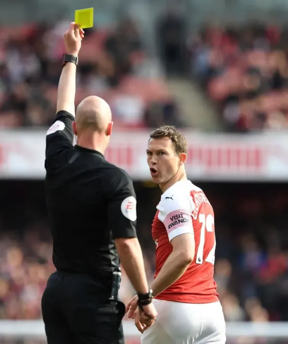 Framed Print : Arsenal's Stephan Lichtsteiner Shown Yellow Card by Referee Anthony Taylor vs. Brighton & Hove Albion