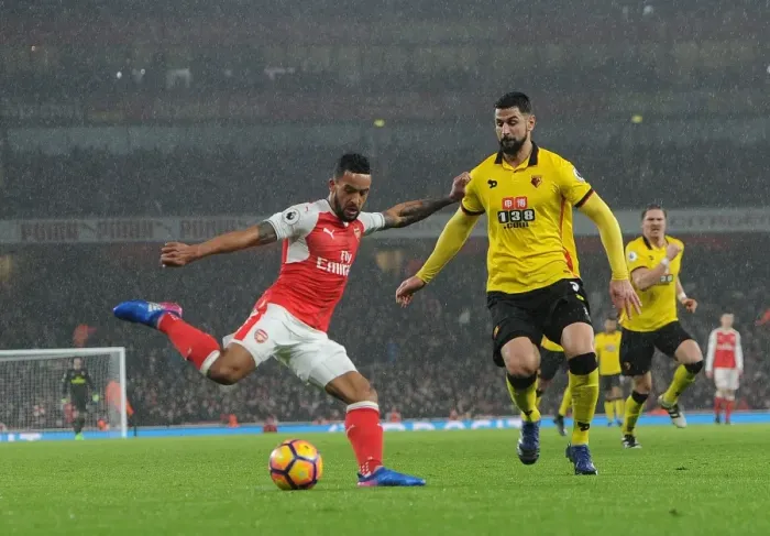 Framed Print : Arsenal's Theo Walcott Battles Past Watford's Miguel Britos in Premier League Clash Framed Print : Arsenal's Theo Walcott Battles Past Watford's Miguel Britos in Premier League Clash