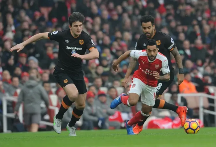 Framed Print : Arsenal's Theo Walcott Clashes with Hull City's Maguire and Huddlestone during Premier League Match