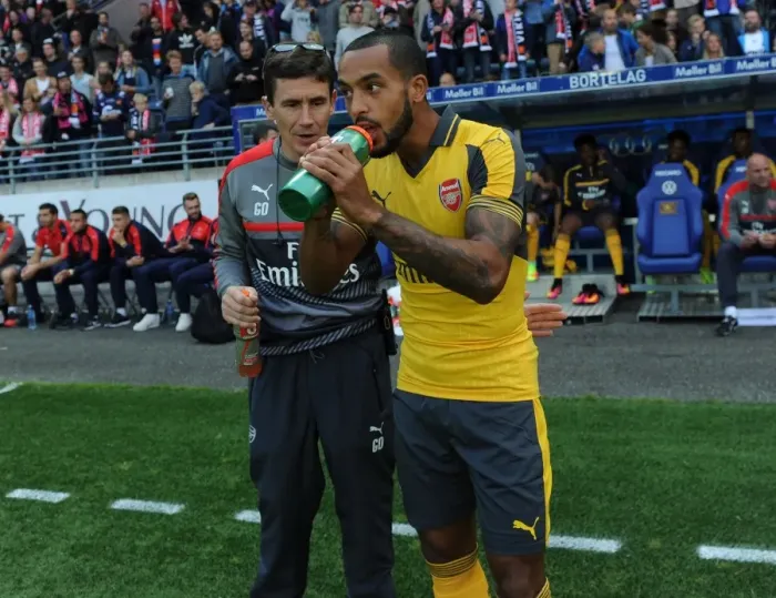 Framed Print : Arsenal's Theo Walcott and Doctor Gary O'Driscoll Before Viking FK Friendly