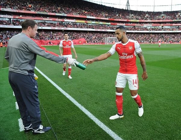 Arsenal's Theo Walcott Hydrates with Physio Colin Lewin Before Arsenal v Swansea City (2016-17)