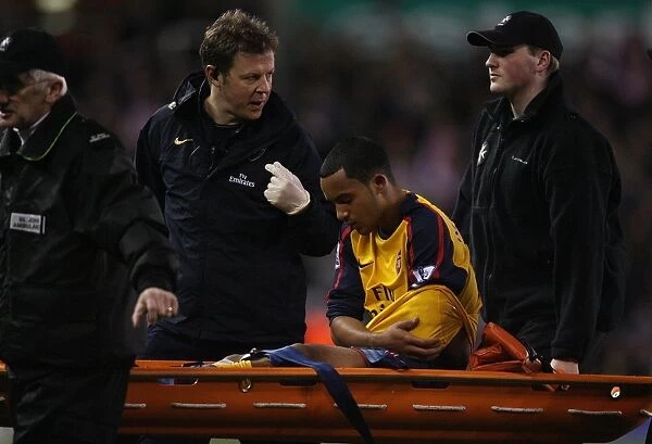 Arsenals Theo Walcott injured after a challenge by