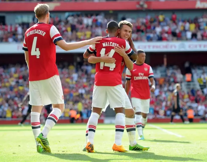 Framed Print : Arsenal's Theo Walcott, Per Mertesacker, and Aaron Ramsey Celebrate Goal Against Galatasaray (2013-14)